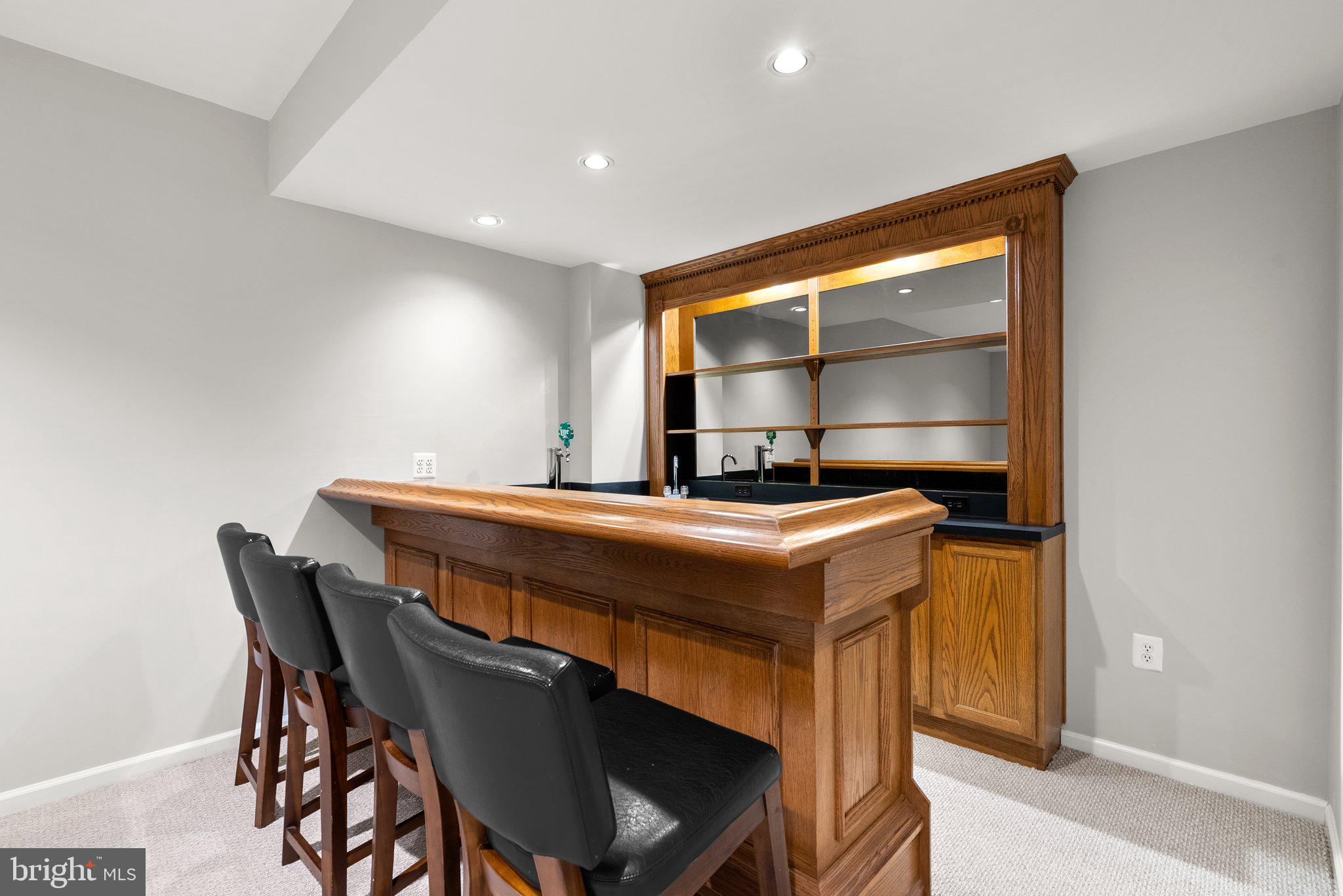 943 Willowleaf Way Potomac, MD 20854 - Photo 35 of 49 a room with a table chairs and a bed