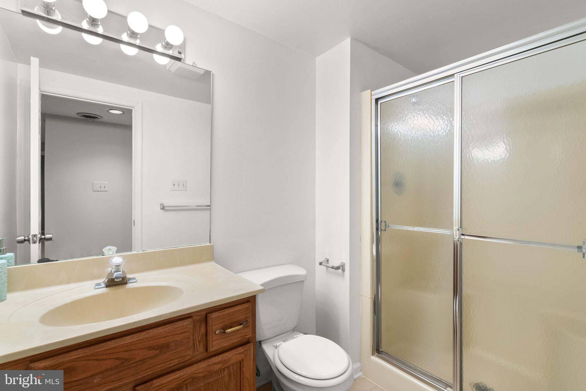 943 Willowleaf Way Potomac, MD 20854 - Photo 36 of 49 a bathroom with a sink toilet and shower