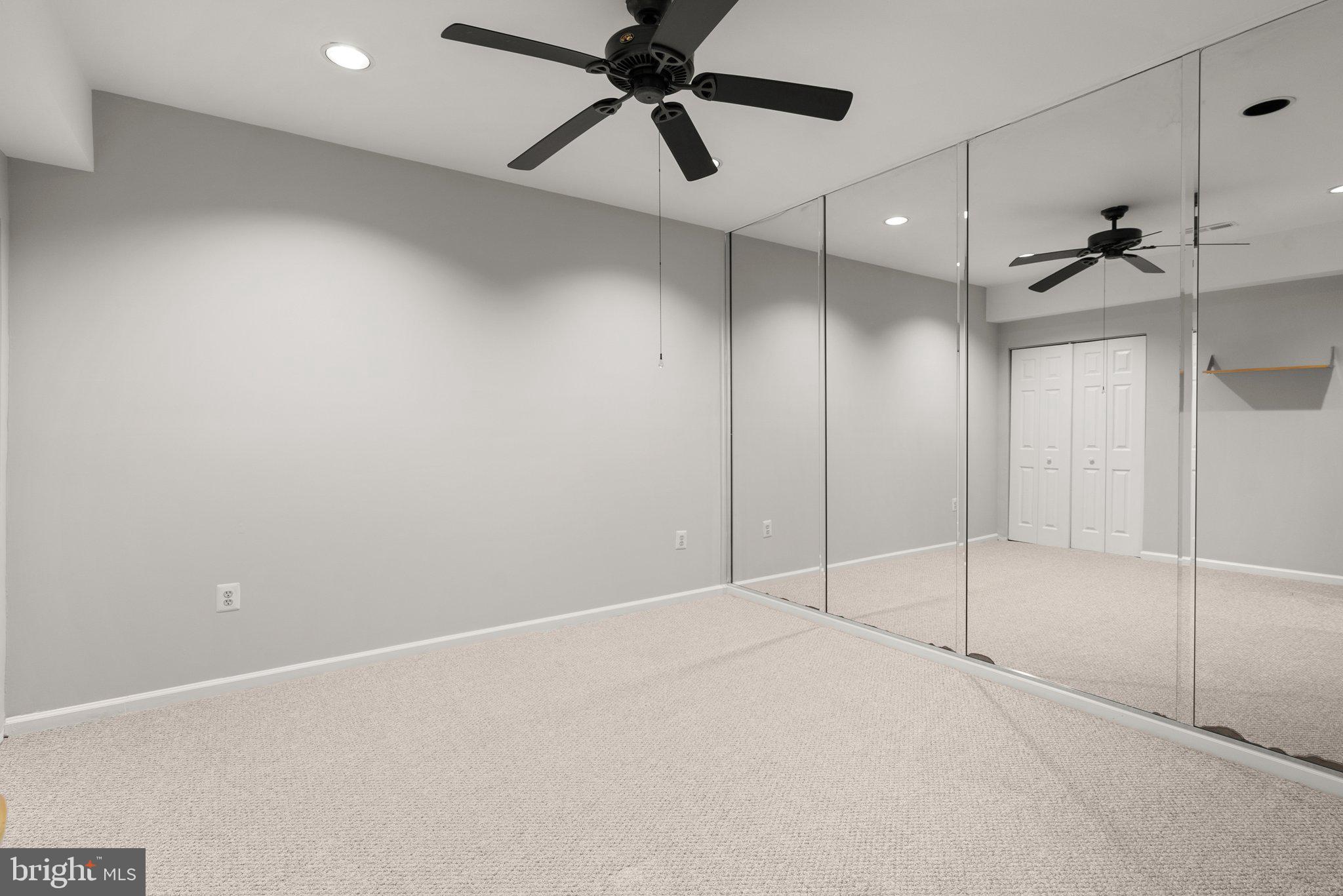 943 Willowleaf Way Potomac, MD 20854 - Photo 40 of 49 a view of an empty room with a fan