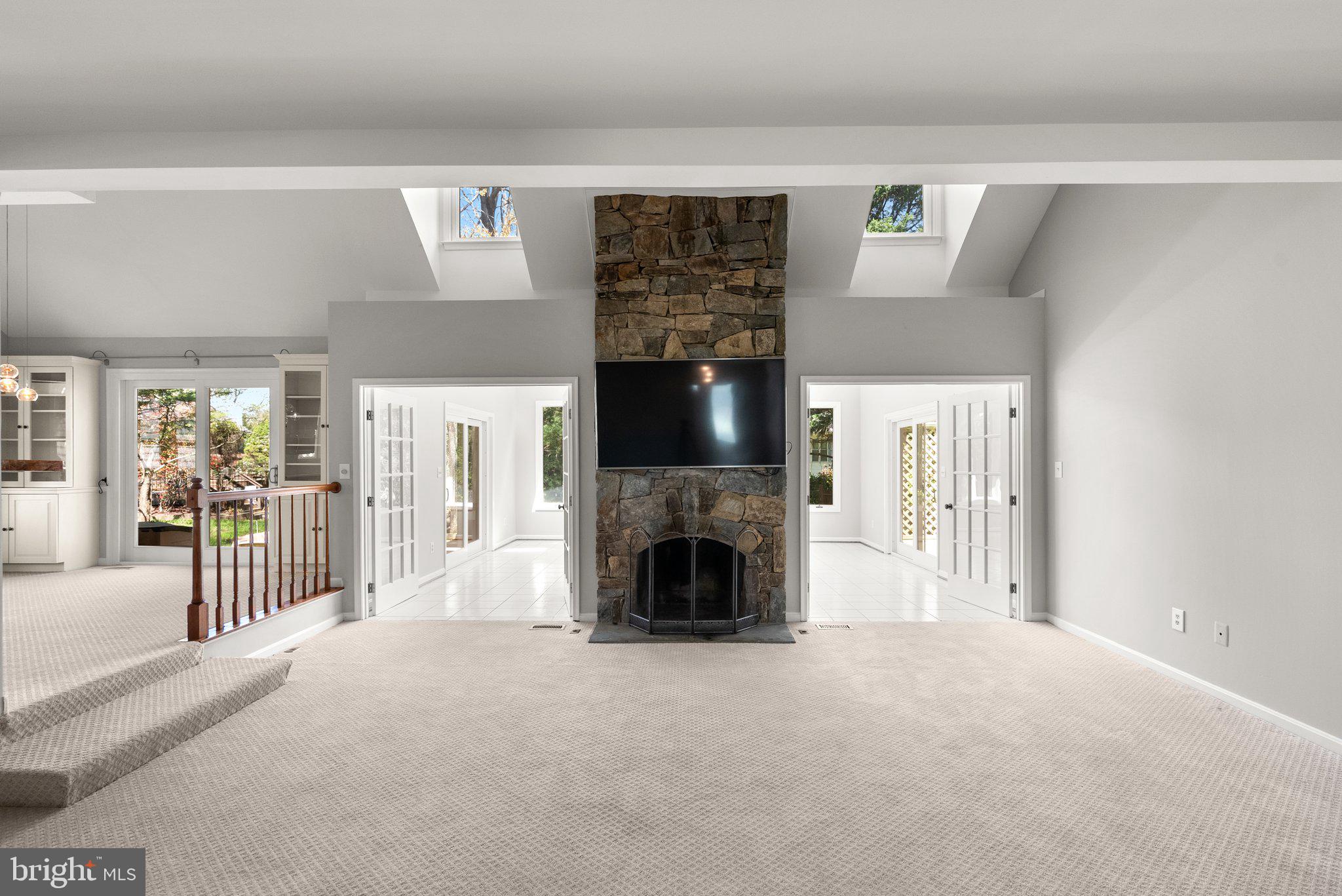 943 Willowleaf Way Potomac, MD 20854 - Photo 6 of 49 a view of a livingroom with a fireplace and chandelier
