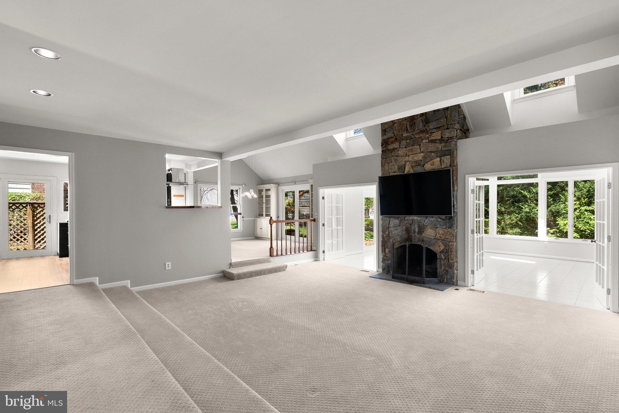 943 Willowleaf Way Potomac, MD 20854 - Photo 7 of 49 a view of empty room with fireplace and large window