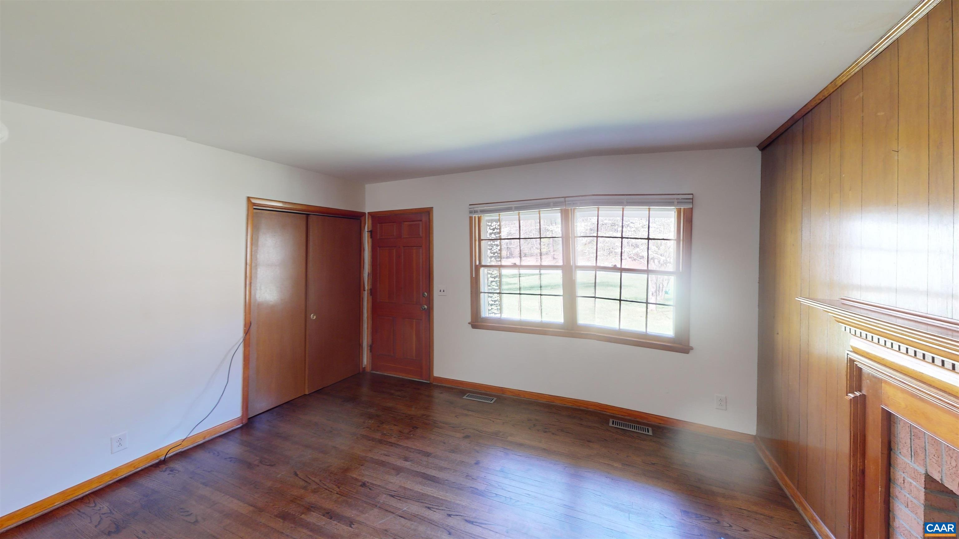 3595 Garth Road Charlottesville, VA 22901 - Photo 13 of 14 an empty room with wooden floor and windows