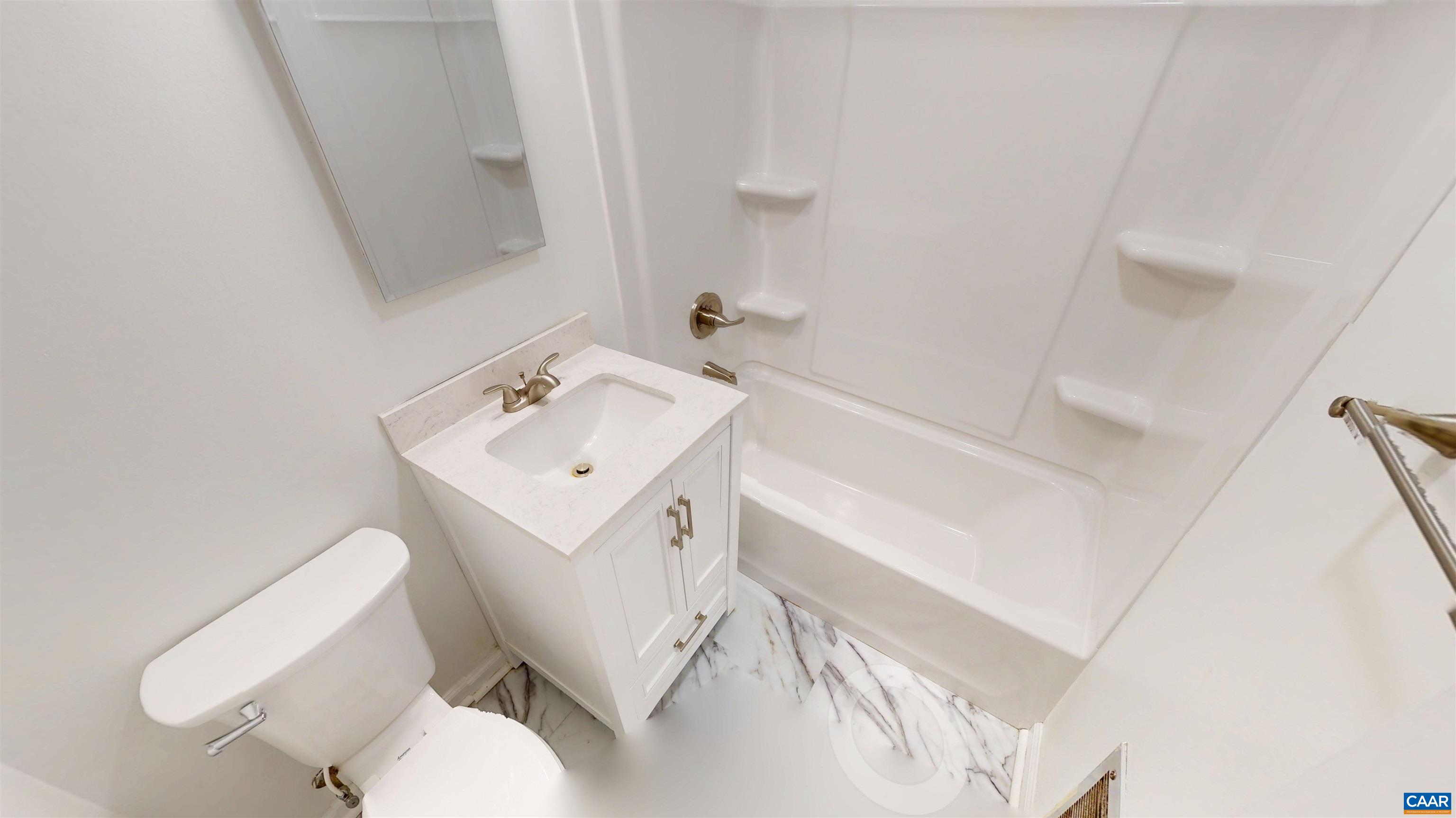 3595 Garth Road Charlottesville, VA 22901 - Photo 4 of 14 a white toilet sitting next to a white sink