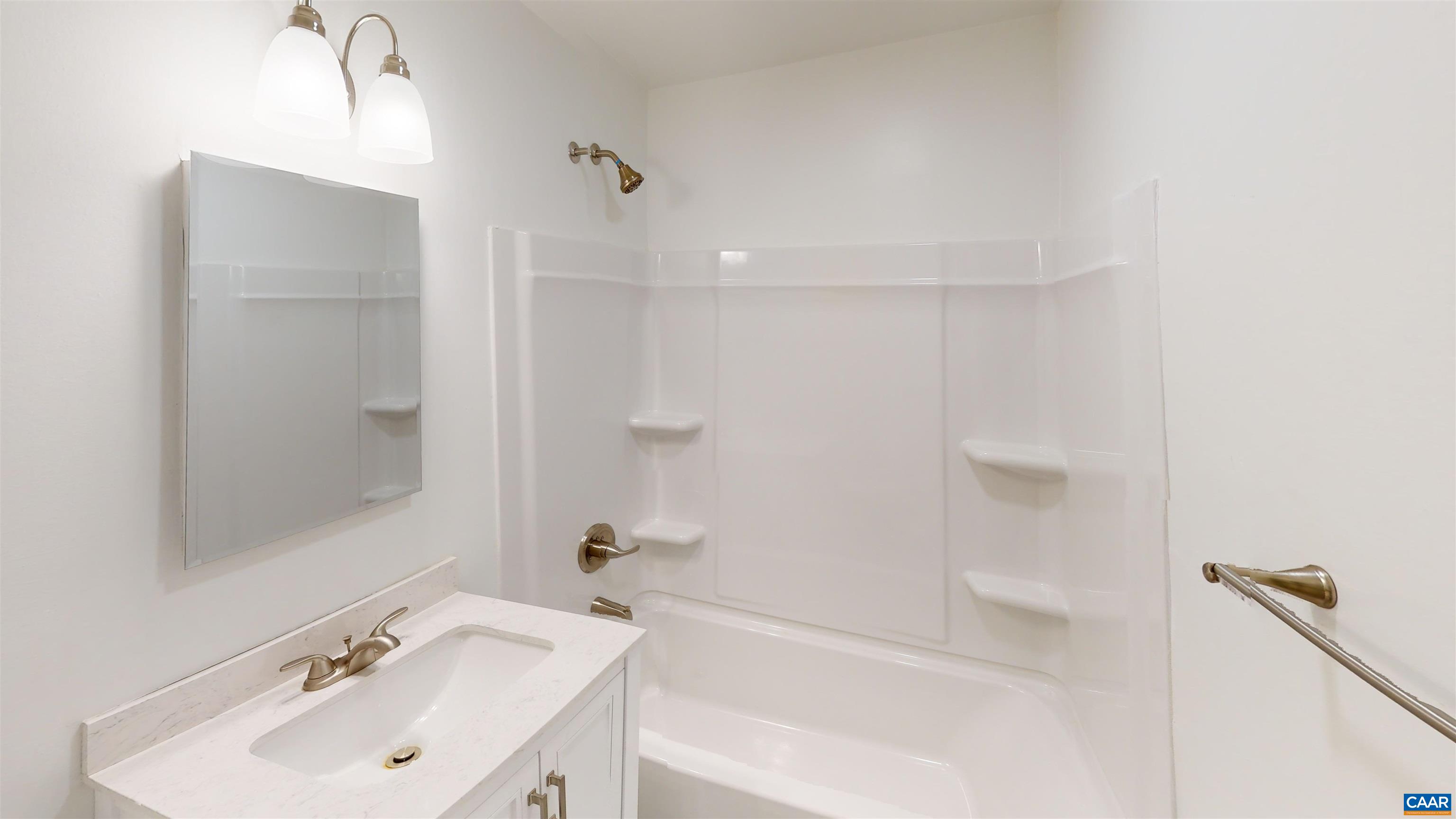3595 Garth Road Charlottesville, VA 22901 - Photo 6 of 14 a bathroom with a bathtub shower sink vanity and a mirror