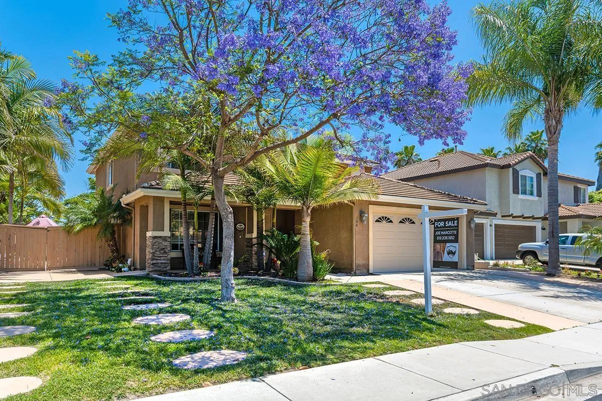 304 River Ranch Way Oceanside, CA 92057 - Photo 1 of 44 a view of a white house with a large tree and a yard in front of it
