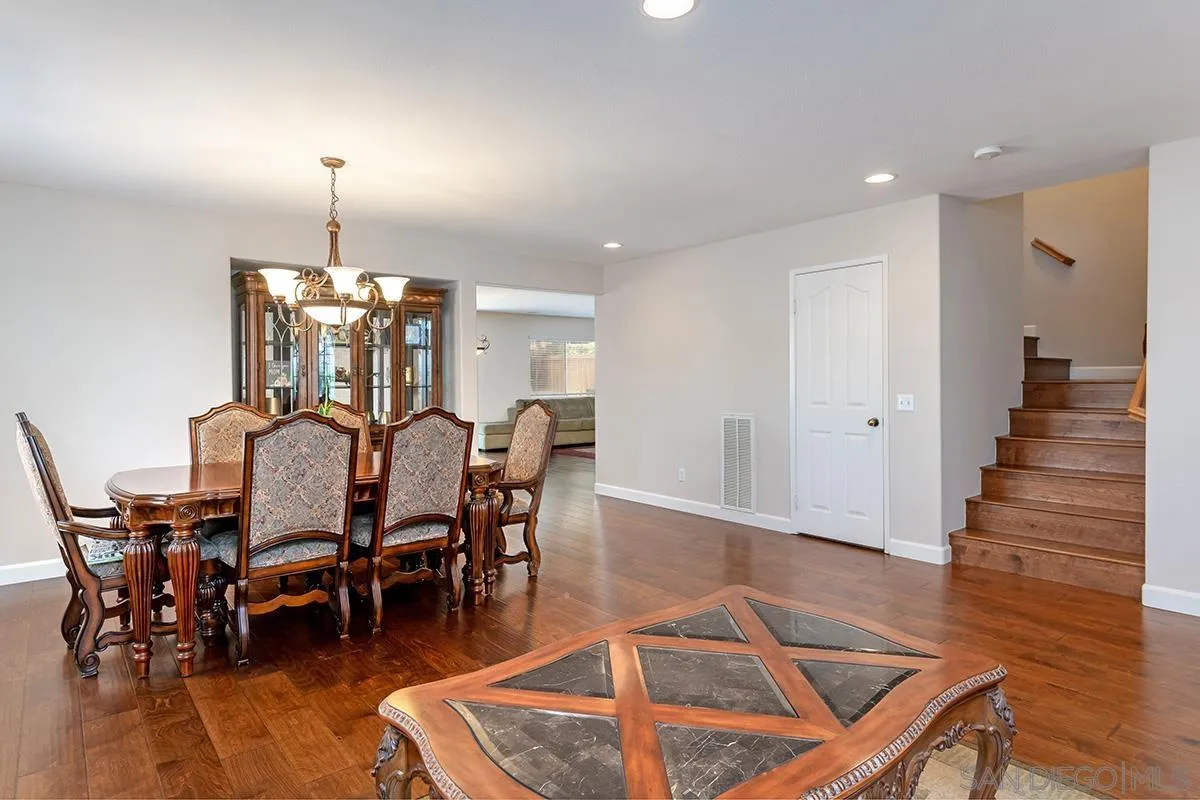 304 River Ranch Way Oceanside, CA 92057 - Photo 14 of 44 a view of a dining room with furniture and wooden floor