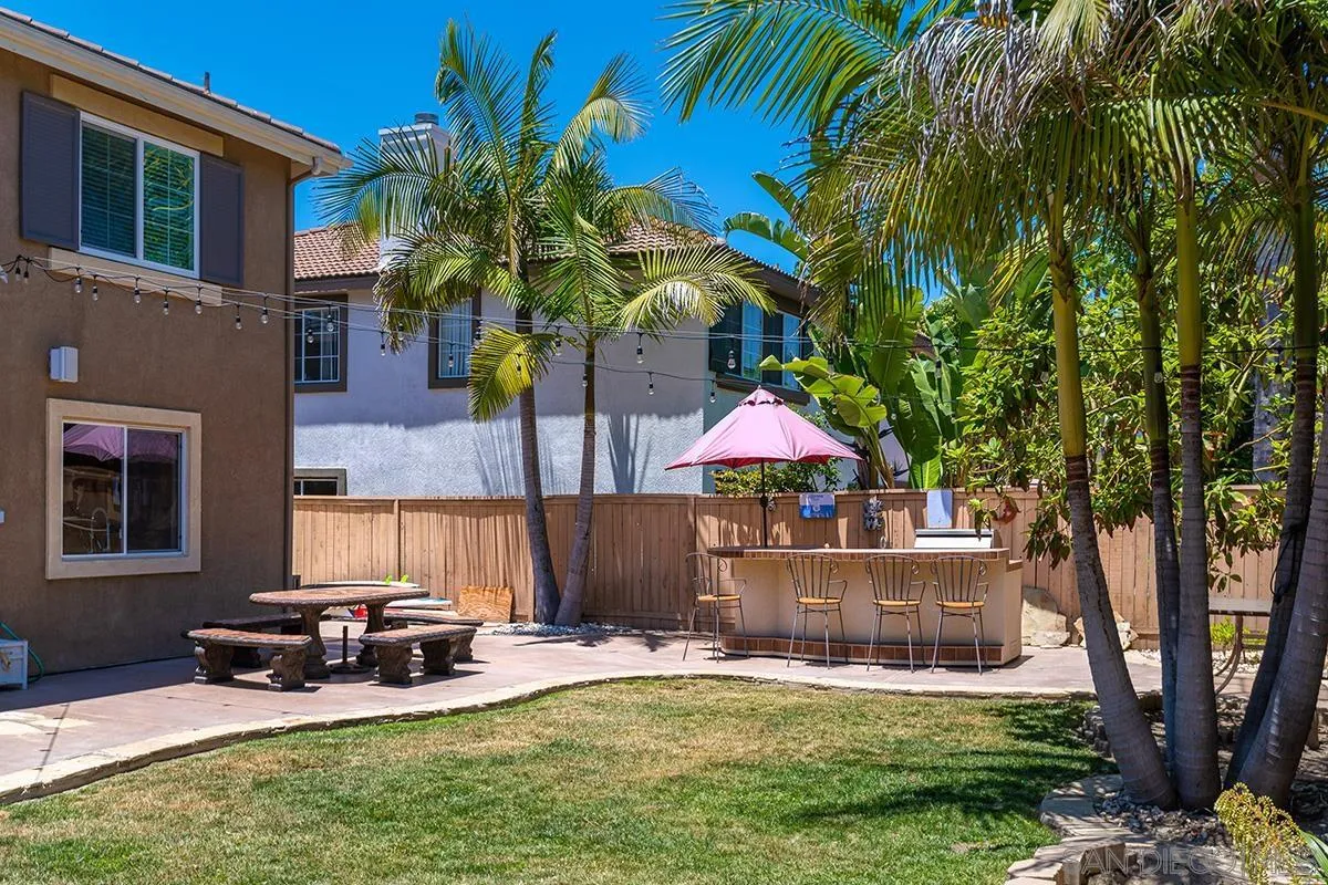 304 River Ranch Way Oceanside, CA 92057 - Photo 16 of 44 a view of a house with backyard and sitting area