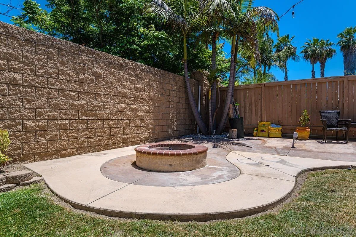 304 River Ranch Way Oceanside, CA 92057 - Photo 19 of 44 a view of a backyard with plants and tree