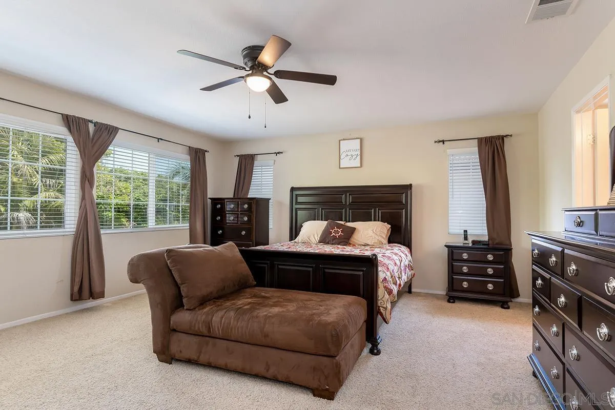 304 River Ranch Way Oceanside, CA 92057 - Photo 29 of 44 a bed room with a bed and a couch