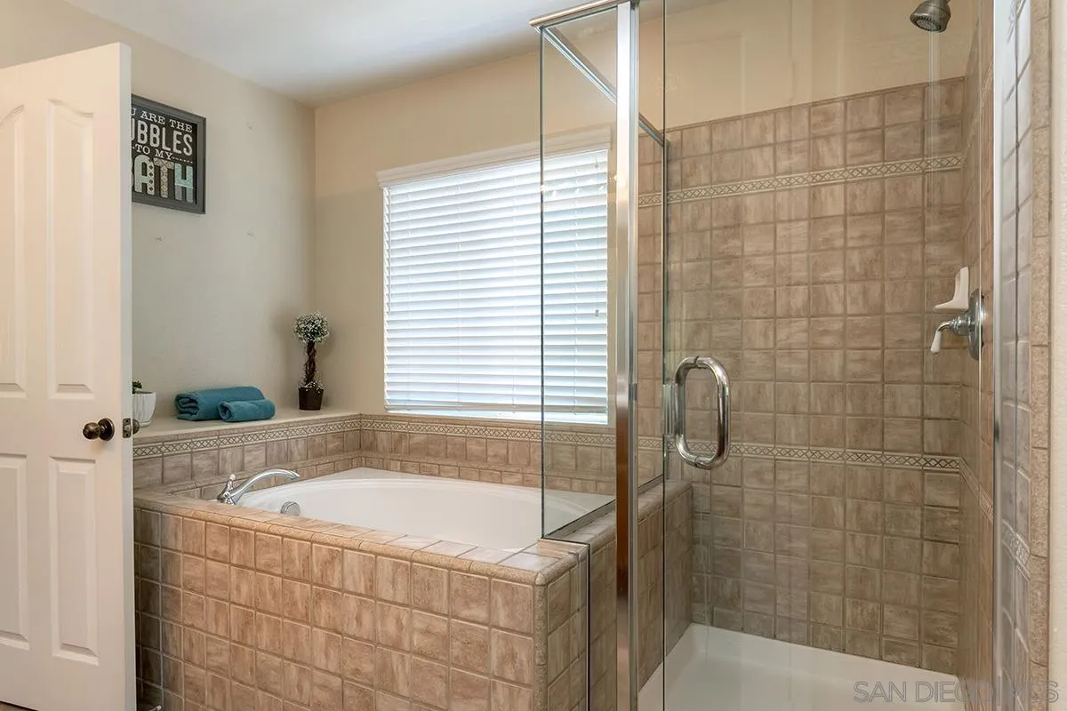 304 River Ranch Way Oceanside, CA 92057 - Photo 31 of 44 a bath tub sitting next to a shower