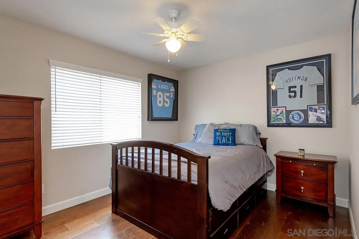 304 River Ranch Way Oceanside, CA 92057 - Photo 33 of 44 a bedroom with a bed and a chandelier