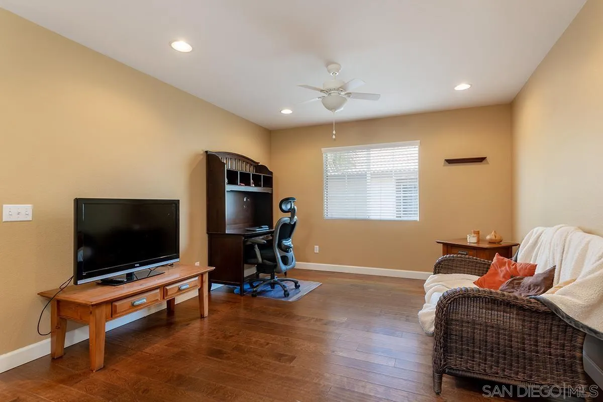 304 River Ranch Way Oceanside, CA 92057 - Photo 35 of 44 a living room with furniture and a flat screen tv