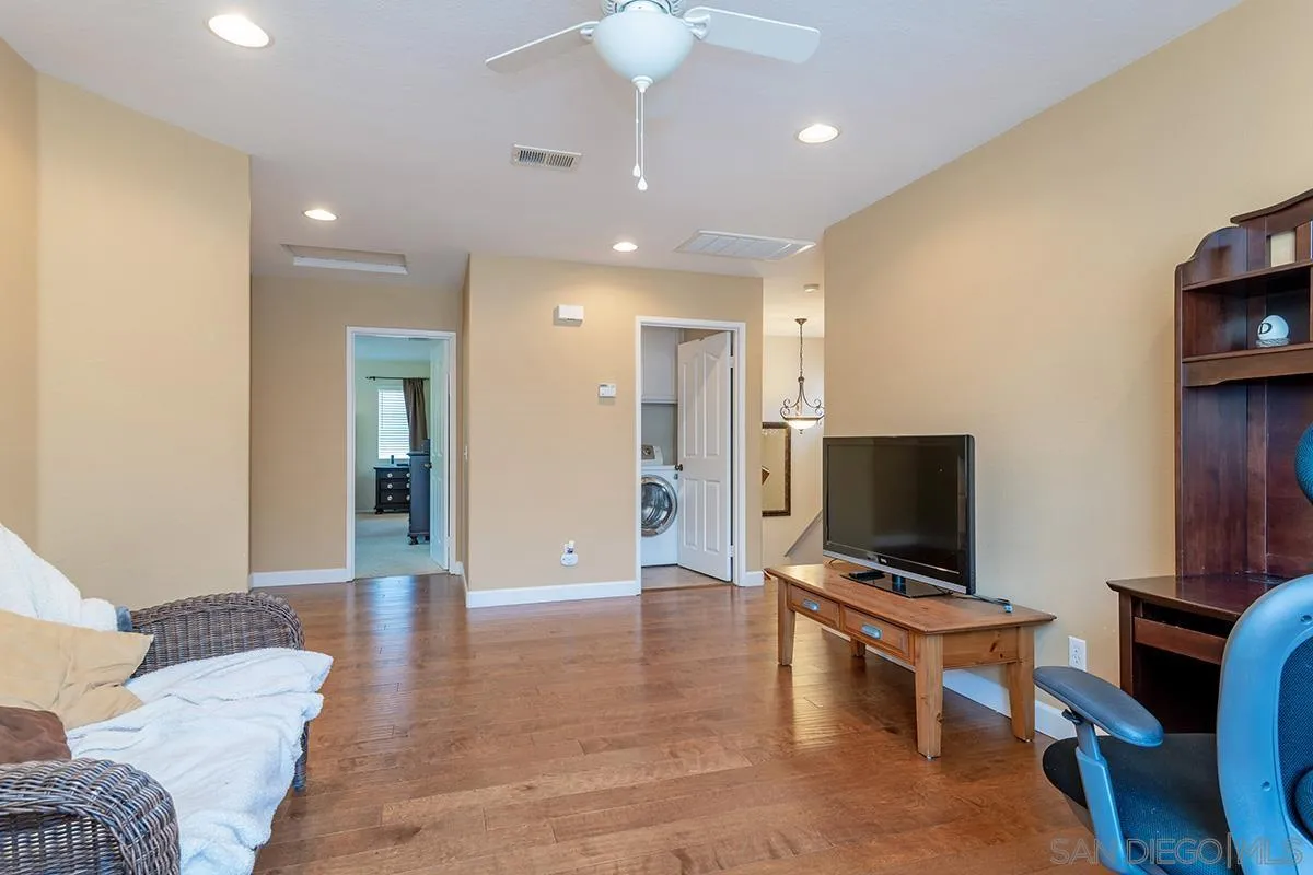 304 River Ranch Way Oceanside, CA 92057 - Photo 36 of 44 a living room with furniture and a flat screen tv