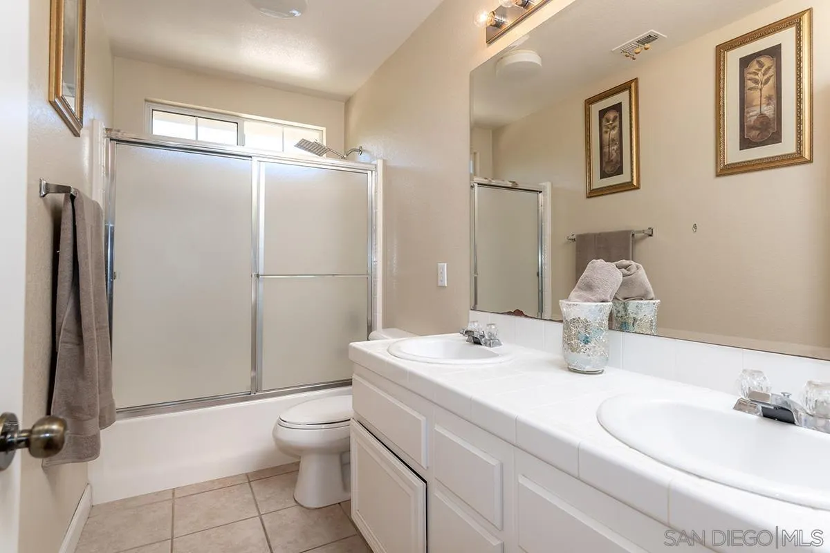 304 River Ranch Way Oceanside, CA 92057 - Photo 38 of 44 a bathroom with a sink toilet and shower