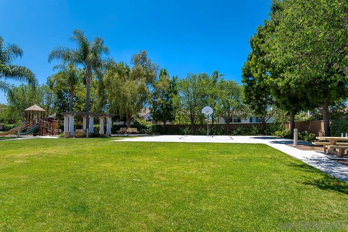 304 River Ranch Way Oceanside, CA 92057 - Photo 43 of 44 a view of a swimming pool with an outdoor space and seating area