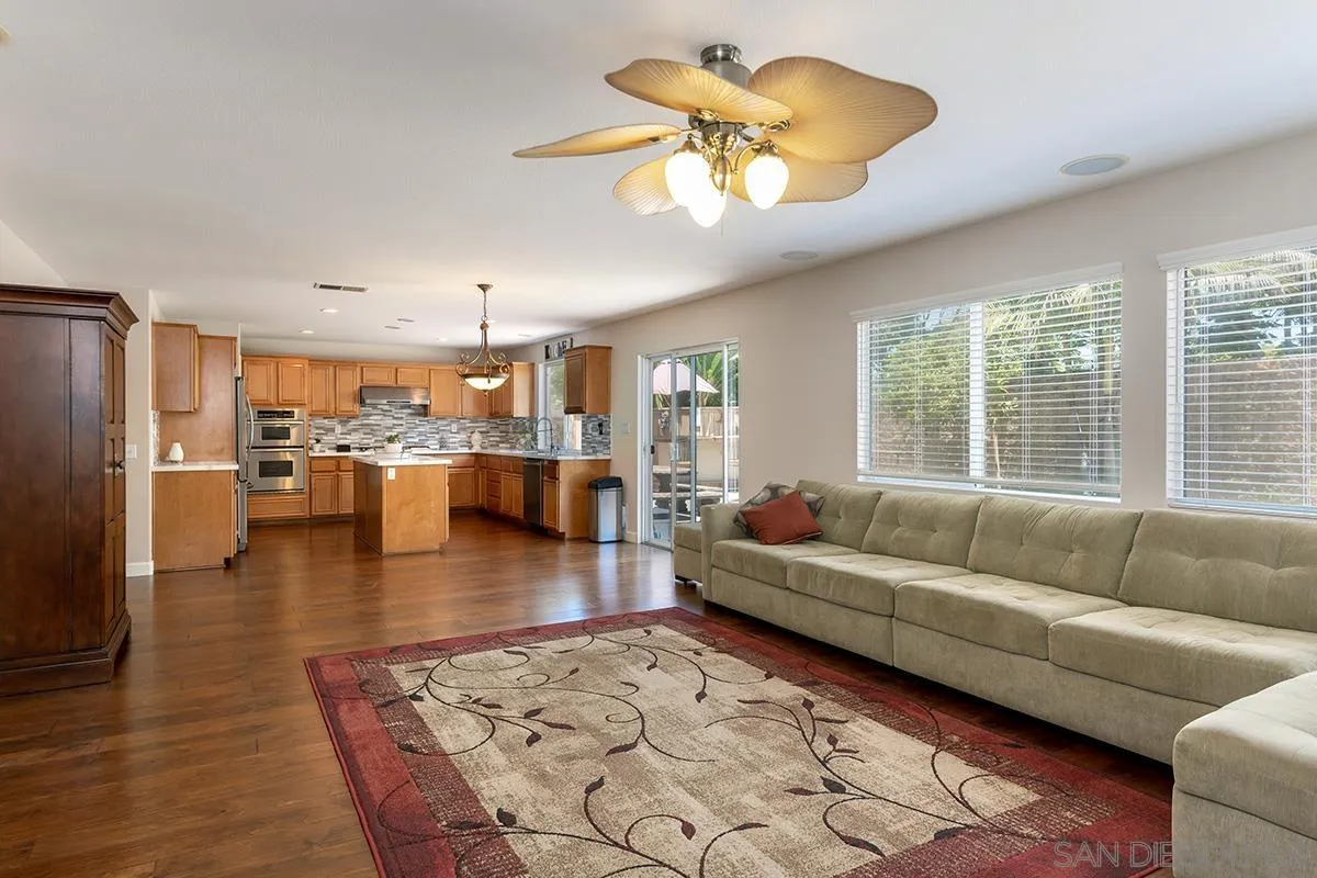 304 River Ranch Way Oceanside, CA 92057 - Photo 9 of 44 a living room with furniture and a large window