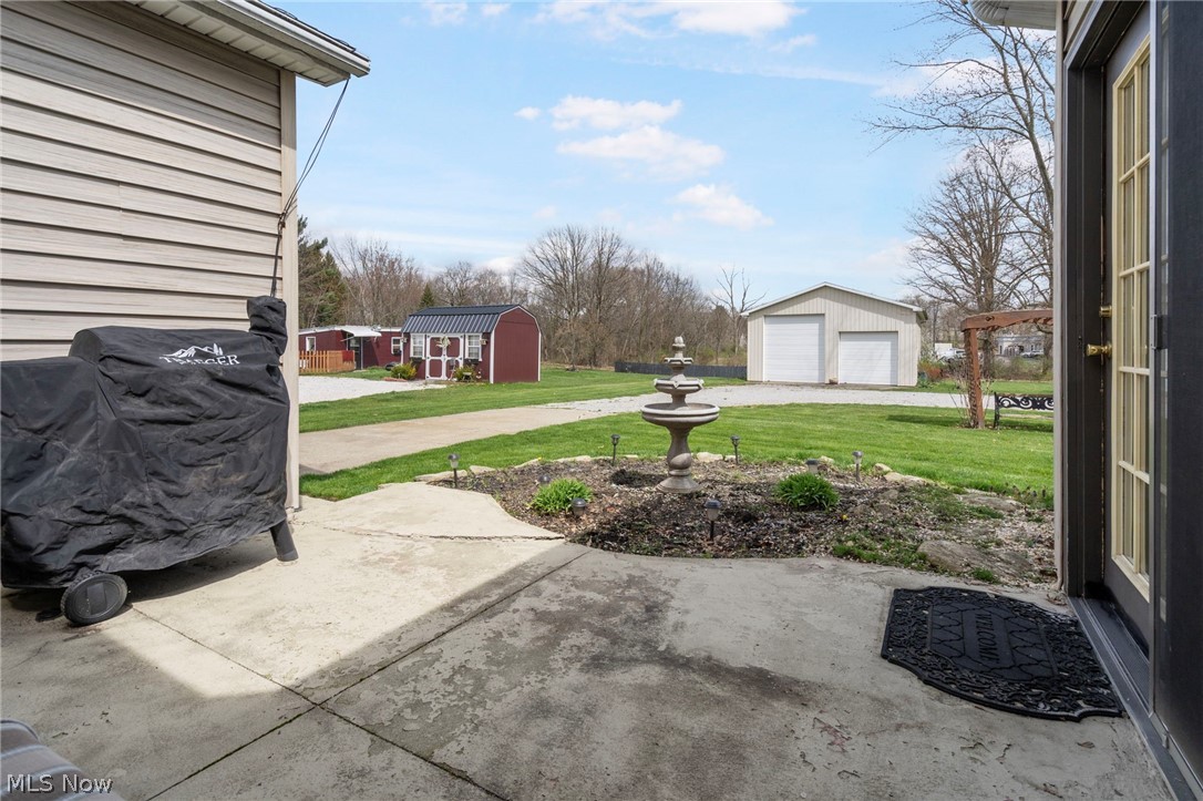 1850 South Sawburg Road Alliance, OH 44601 - Photo 28 of 39 View of patio / terrace with a 32 x 40 pole building and a garage