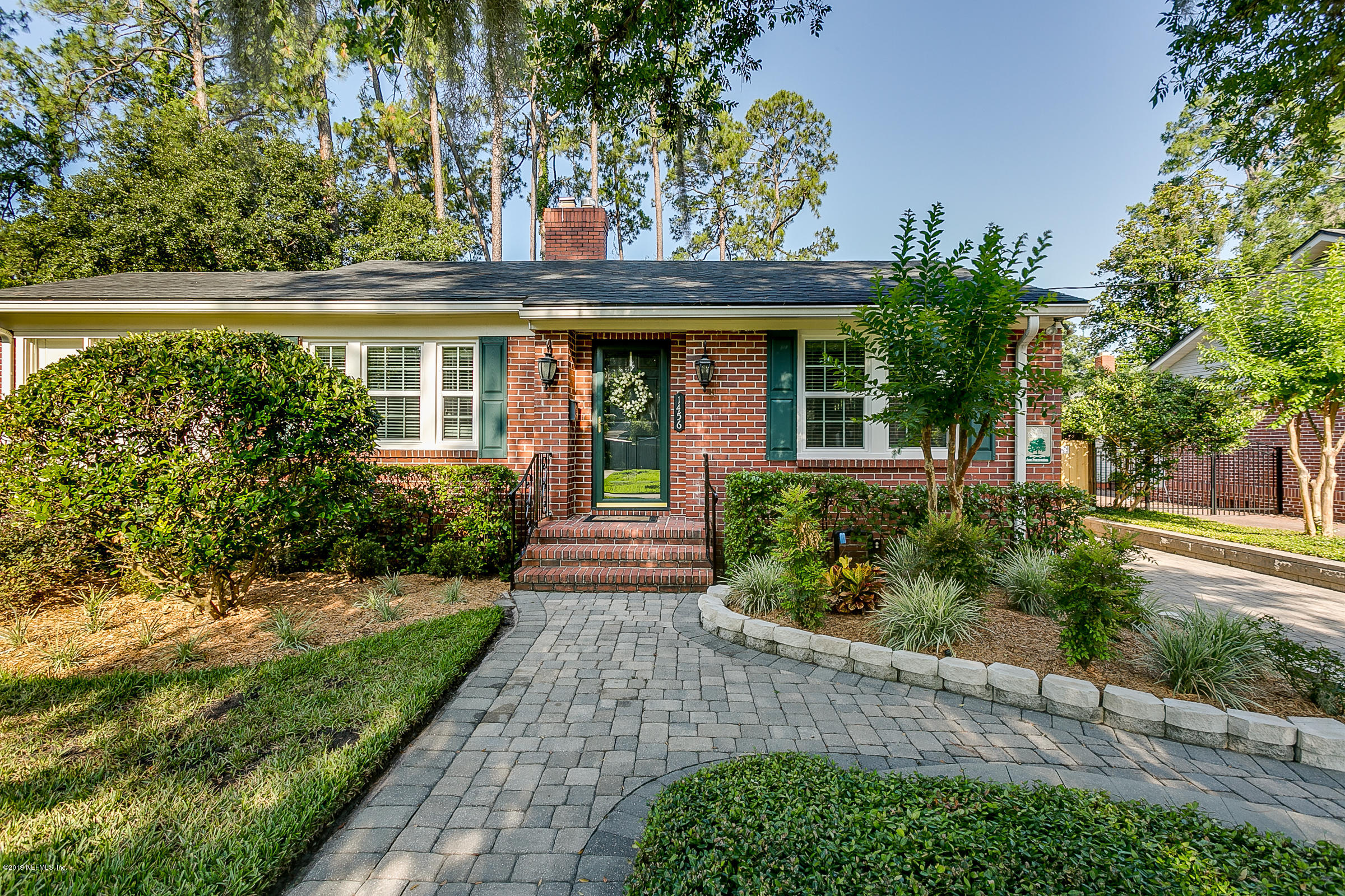 1456 Nicholson Road Jacksonville, FL 32207 - Photo 1 of 27 a front view of a house with a yard