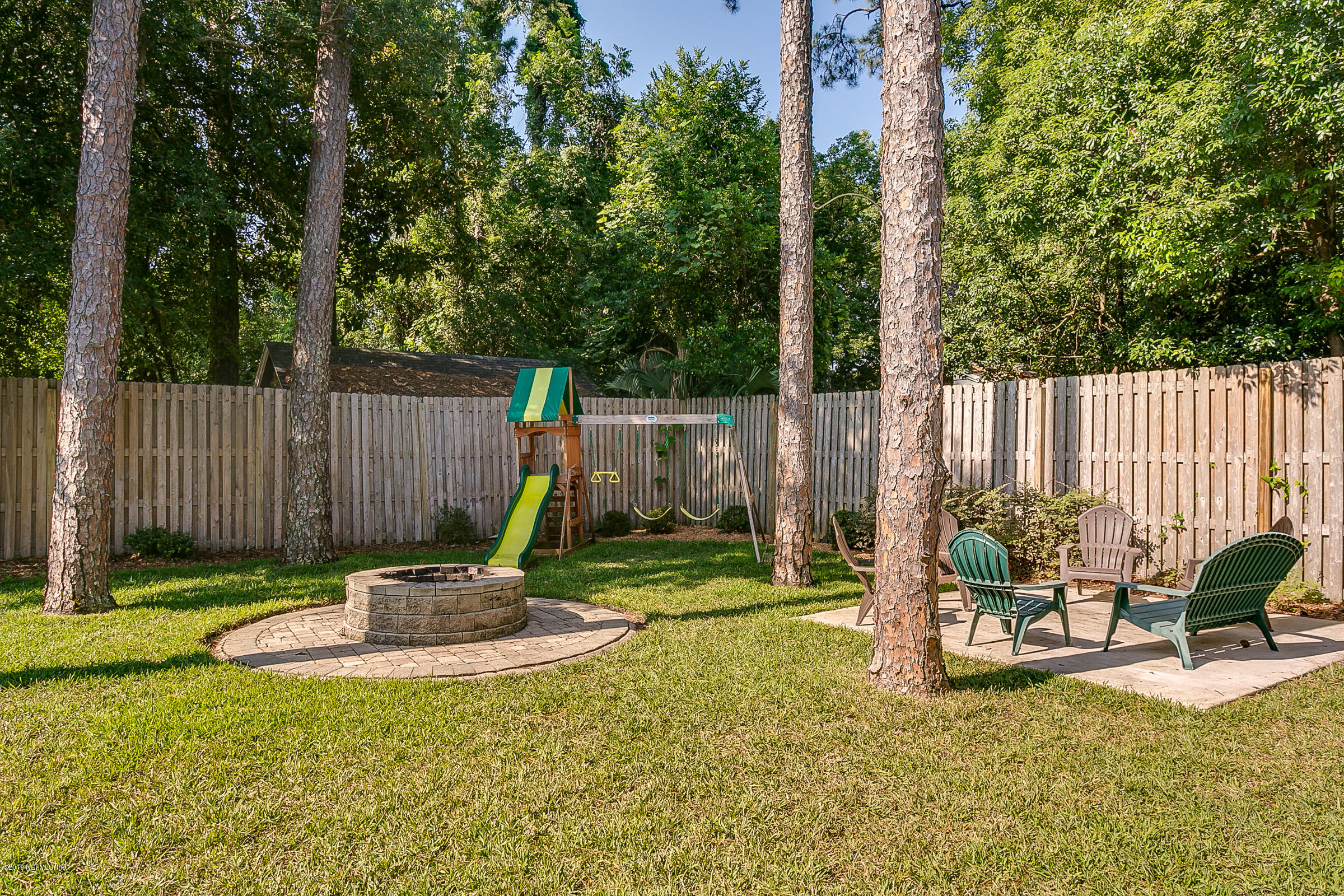1456 Nicholson Road Jacksonville, FL 32207 - Photo 23 of 27 a view of a table and chairs in the patio