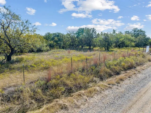 a view of a lake with a yard