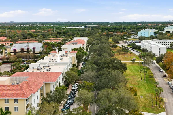 an aerial view of a house with outdoor space and lake view