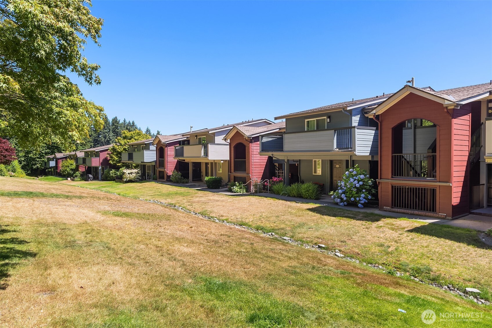 15711 Waynita Way Northeast, Unit H106 Bothell, WA 98011 - Photo 19 of 20 a front view of a house with a yard