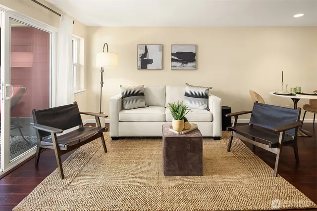 a living room with furniture and a rug