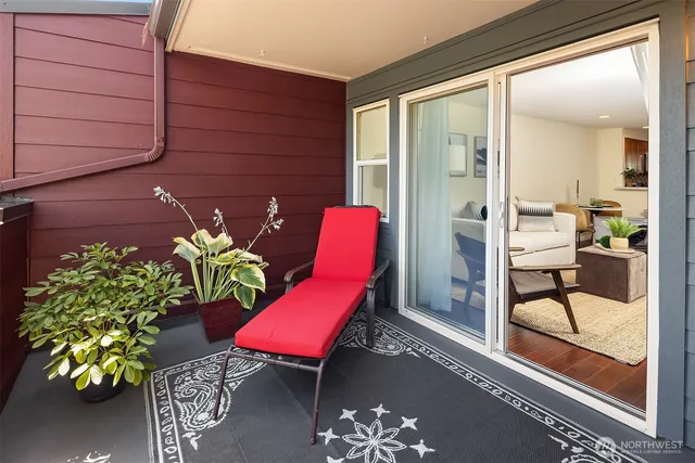 a outdoor dining space with furniture and a potted plant