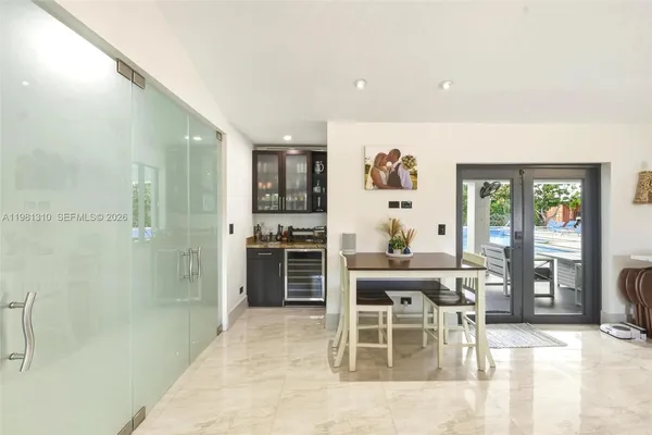 a dining room with furniture and window