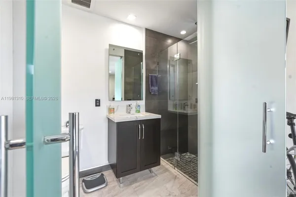 a bathroom with a shower and a toilet