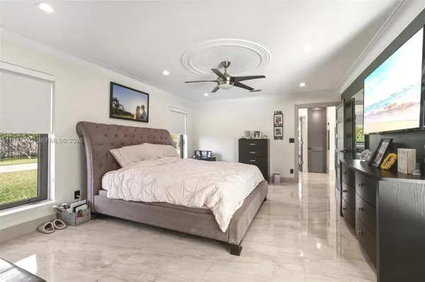 a open kitchen with stainless steel appliances granite countertop a stove and a refrigerator