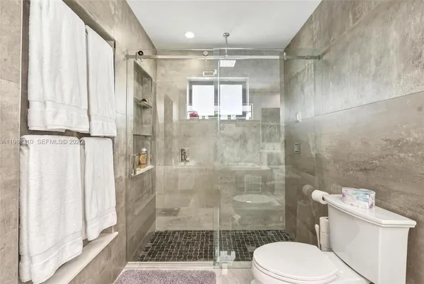 a bathroom with a toilet and a sink