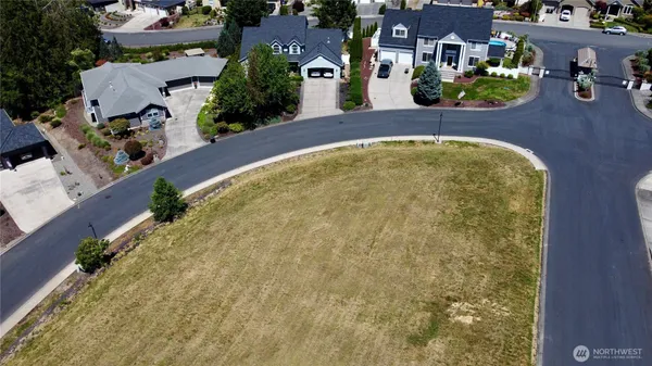 an aerial view of a house with a swimming pool yard and outdoor seating