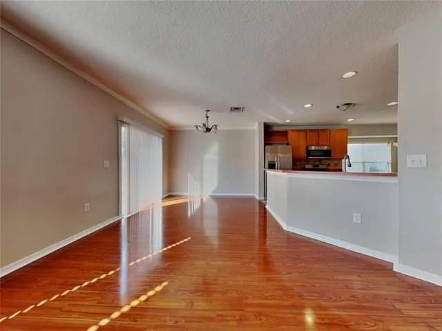 a view of a kitchen with a sink and microwave
