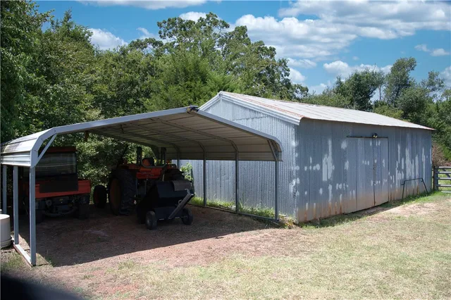 a view of patio with wooden fence