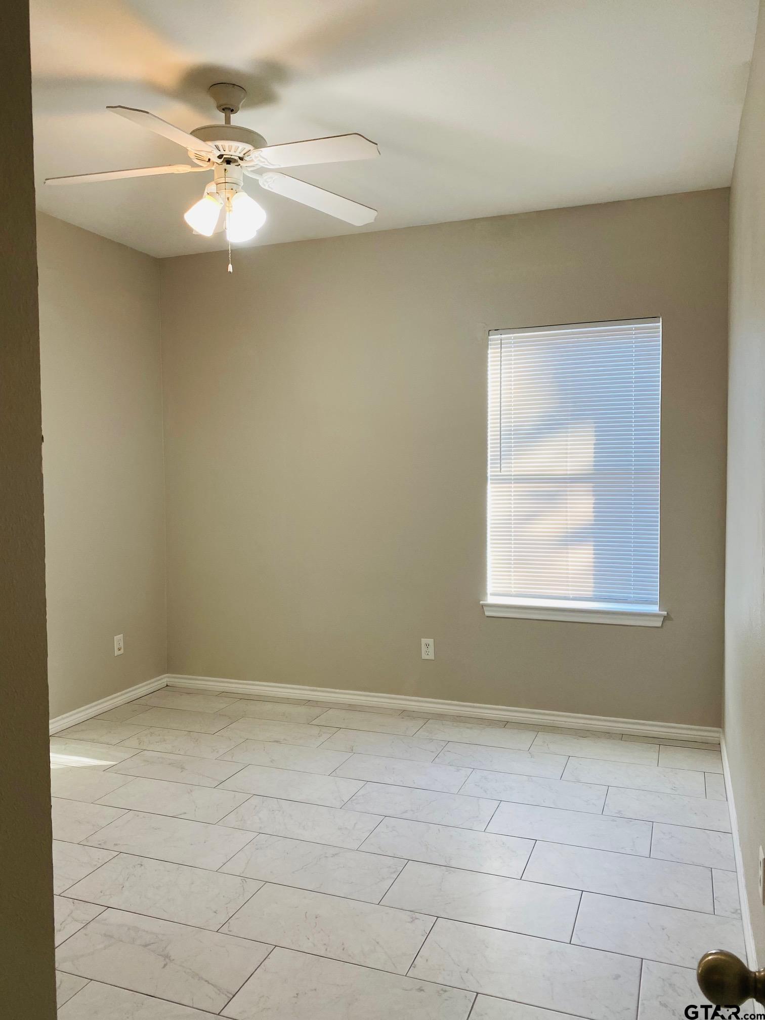 19586 FM 2493 Flint, TX 75762 - Photo 11 of 15 wooden floor in an empty room with a window
