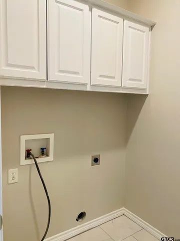 a bathroom with a sink and cabinets
