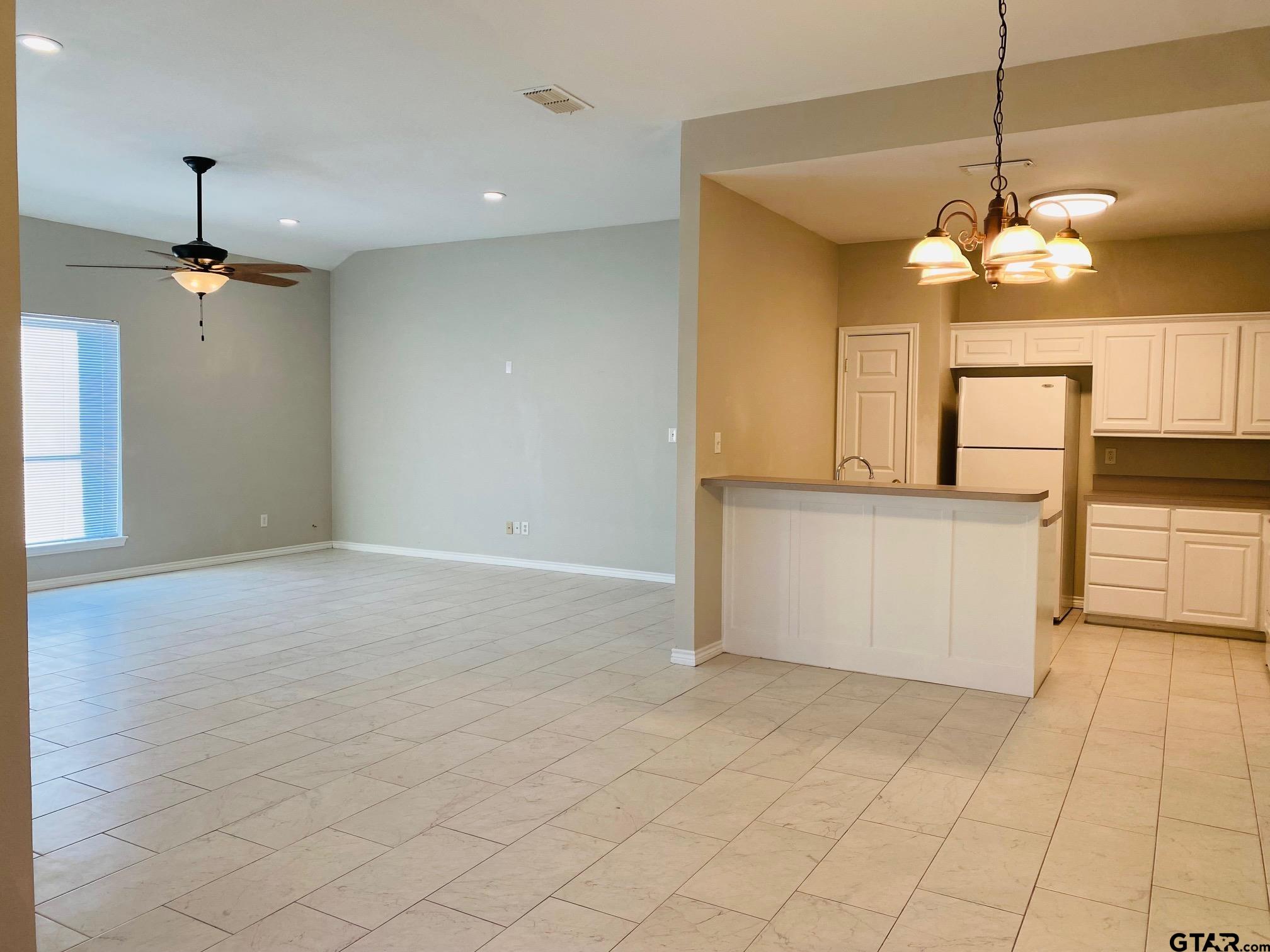 19586 FM 2493 Flint, TX 75762 - Photo 3 of 15 a view of a kitchen with a cabinet and a chandelier