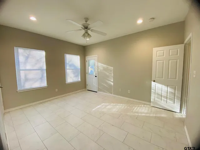 a view of an empty room with a window