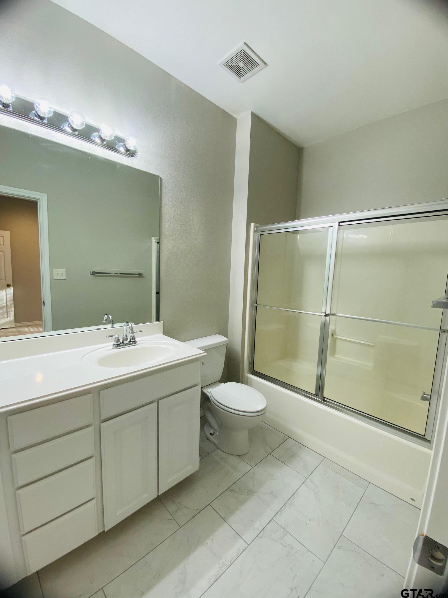 19586 FM 2493 Flint, TX 75762 - Photo 10 of 15 a bathroom with a toilet sink and shower