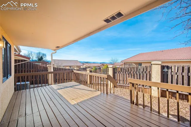 a balcony with wooden floor