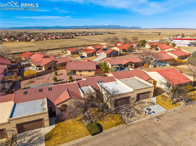 an aerial view of residential houses with outdoor space