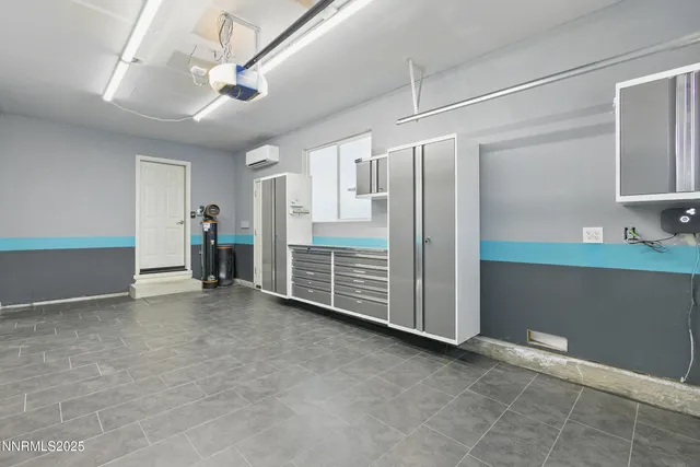 a view of an empty room with closet and a window