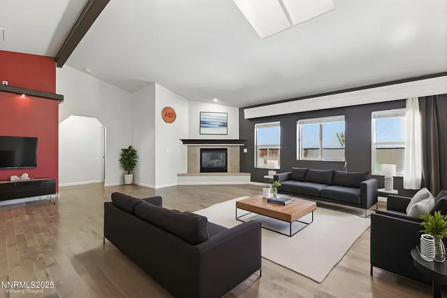 a living room with furniture window and a fireplace