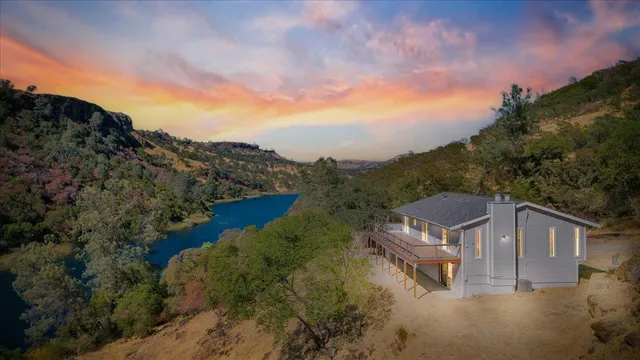 a view of a house with a mountain in the background