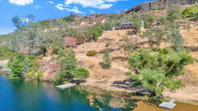 a view of a kitchen with a sink and a refrigerator