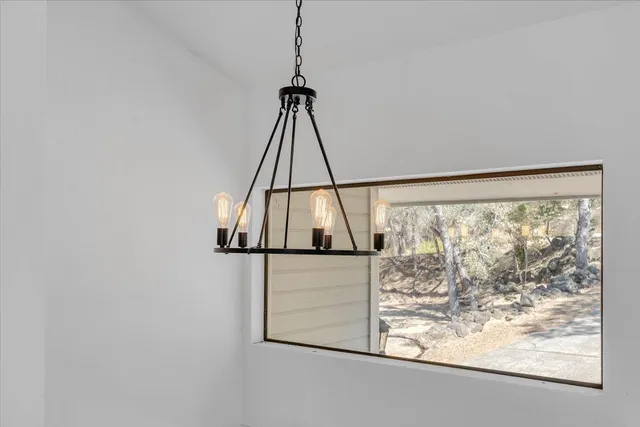 a view of a balcony with wooden floor and fence