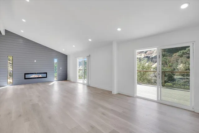 a kitchen with white cabinets and appliances
