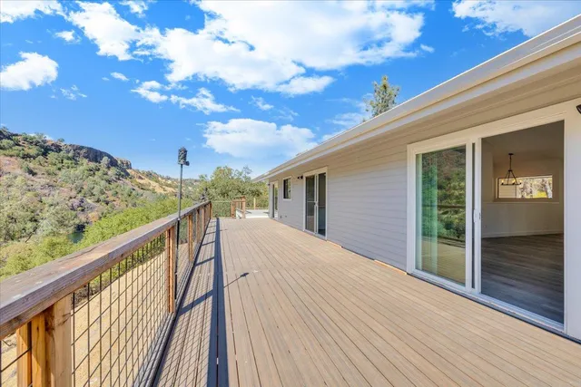 an empty room with cabinet and glass door