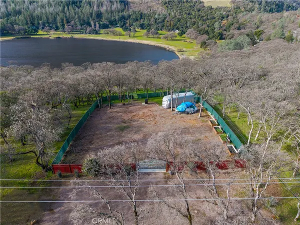 a view of a lake with a yard and a large park